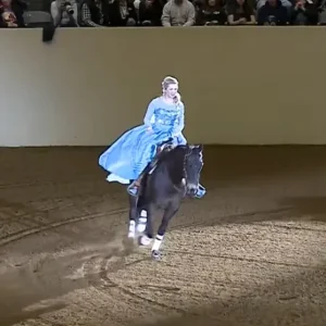 She rides up on a horse, then she removes her cape and STUNS everyone (VIDEO)