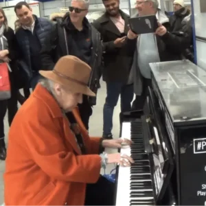At the public piano, an elderly woman plays ragtime like a goddess.