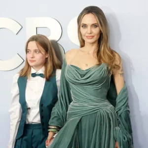 Fans divided after Angelina Jolie, 49, debuts fresh look at at awards show with draped gown and new hair color